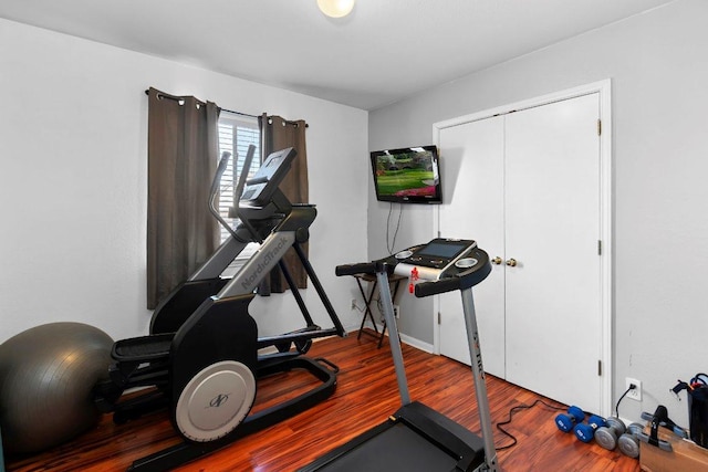 workout area featuring wood finished floors