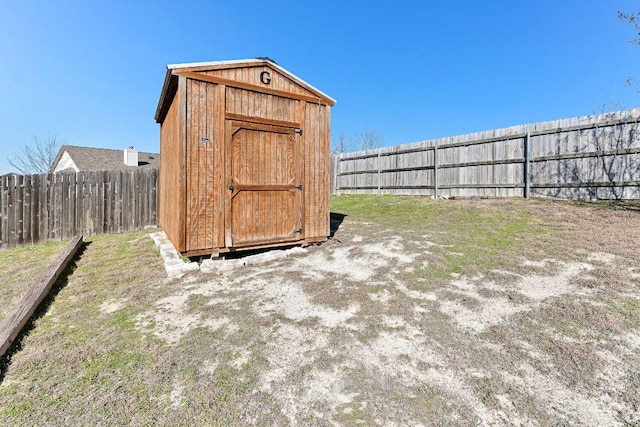 view of shed featuring a fenced backyard