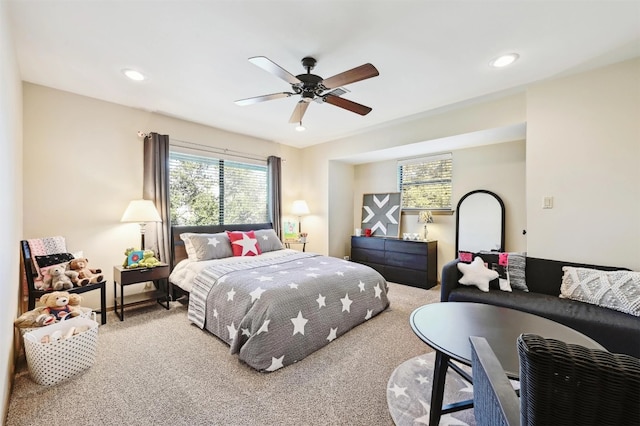 bedroom featuring recessed lighting, multiple windows, and carpet