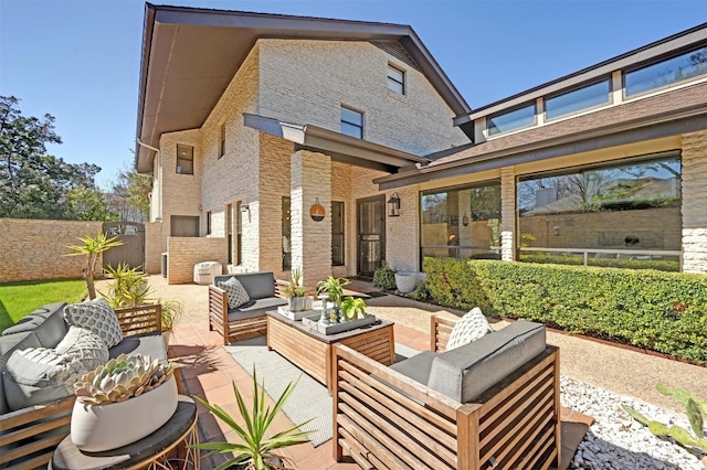 view of patio / terrace with outdoor lounge area and fence