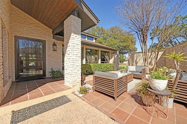 view of patio with an outdoor hangout area and fence