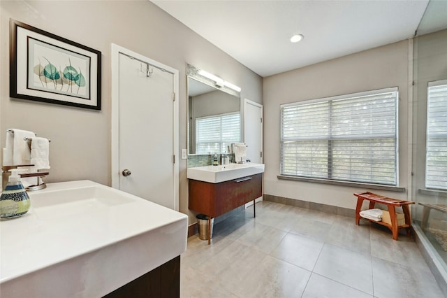 bathroom featuring recessed lighting, tile patterned flooring, vanity, and baseboards