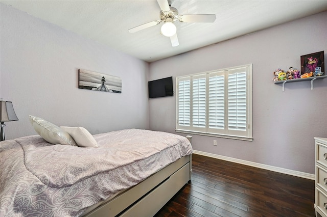 bedroom featuring dark wood-style floors, ceiling fan, and baseboards