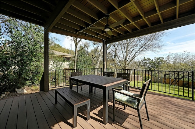 wooden terrace featuring ceiling fan and outdoor dining area