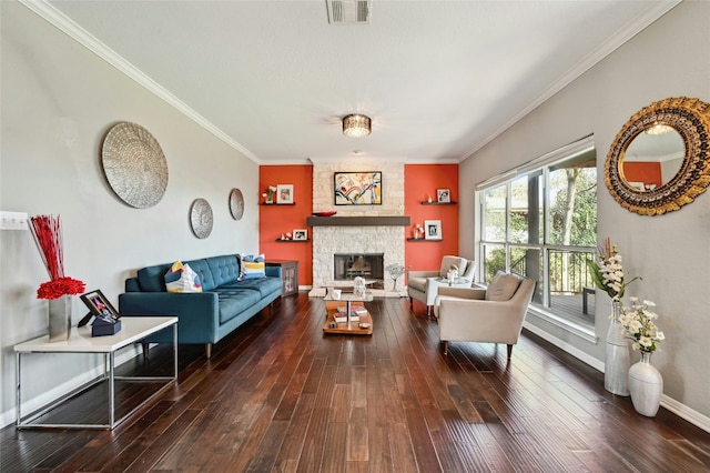 living area with dark wood-style floors, visible vents, a fireplace, and crown molding