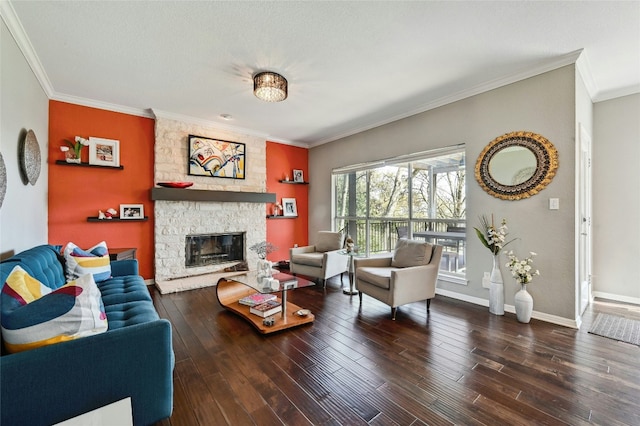 living room featuring crown molding, a fireplace, baseboards, and wood finished floors