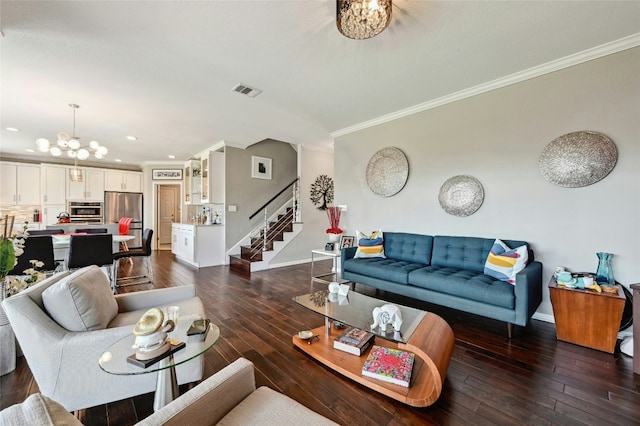 living room with baseboards, ornamental molding, dark wood-style flooring, stairs, and a chandelier