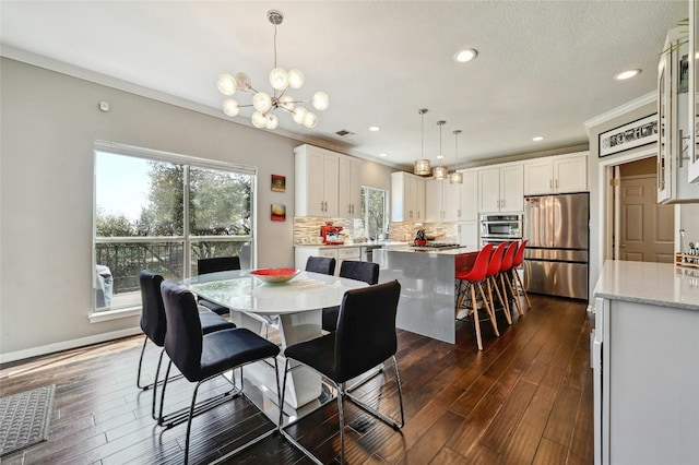 dining space with recessed lighting, a notable chandelier, baseboards, dark wood-style floors, and crown molding