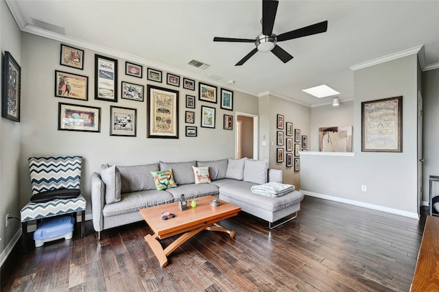 living room featuring a skylight, wood finished floors, visible vents, baseboards, and crown molding