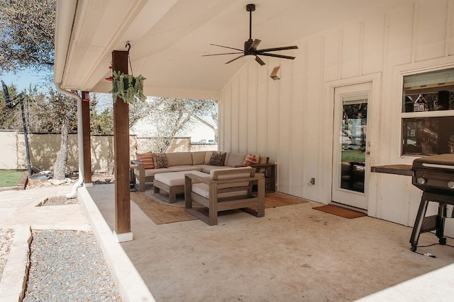 view of patio with fence, an outdoor hangout area, and a ceiling fan