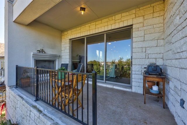 view of patio featuring a balcony