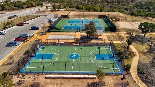 view of basketball court with fence