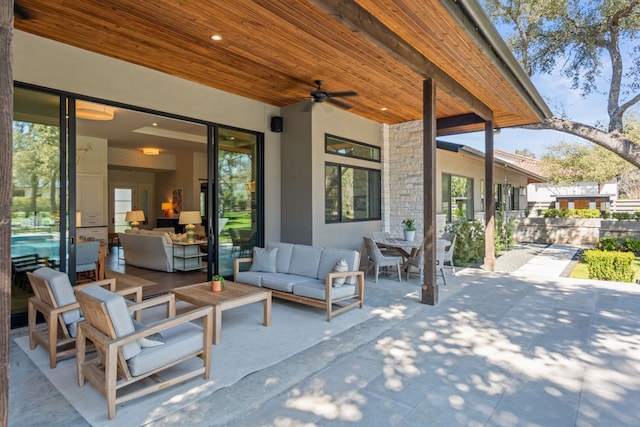 view of patio featuring an outdoor living space and ceiling fan