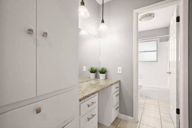611 Virginia Dr, Round Rock, TX 78664 - bathroom featuring vanity, toilet, tile patterned flooring, shower / tub combination, and baseboards