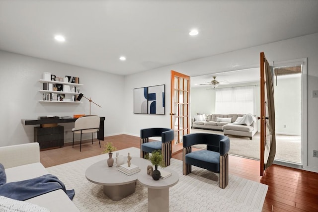 living area with french doors, recessed lighting, a ceiling fan, wood finished floors, and baseboards