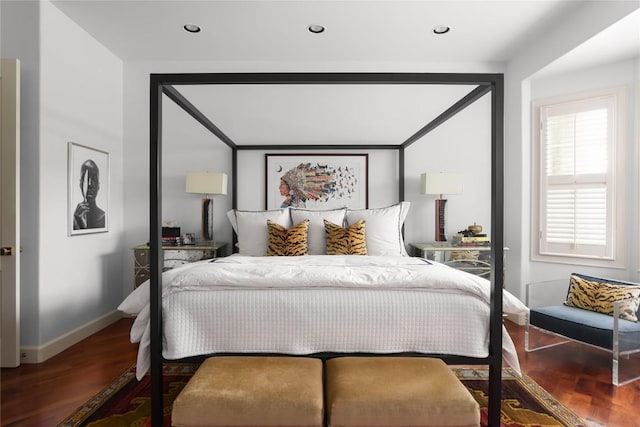 bedroom featuring recessed lighting, wood finished floors, and baseboards