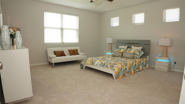 bedroom featuring a ceiling fan, carpet flooring, and baseboards