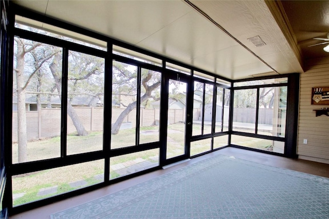 unfurnished sunroom with visible vents