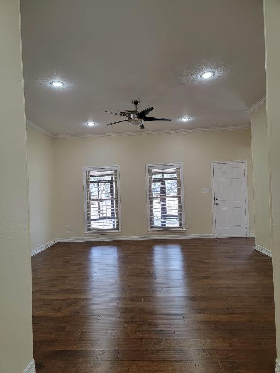 unfurnished room featuring ceiling fan, recessed lighting, wood finished floors, baseboards, and ornamental molding