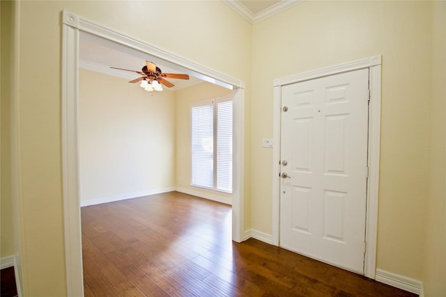 entrance foyer featuring dark wood-style floors, ornamental molding, baseboards, and ceiling fan