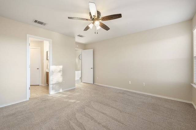 unfurnished bedroom featuring baseboards, visible vents, and carpet flooring