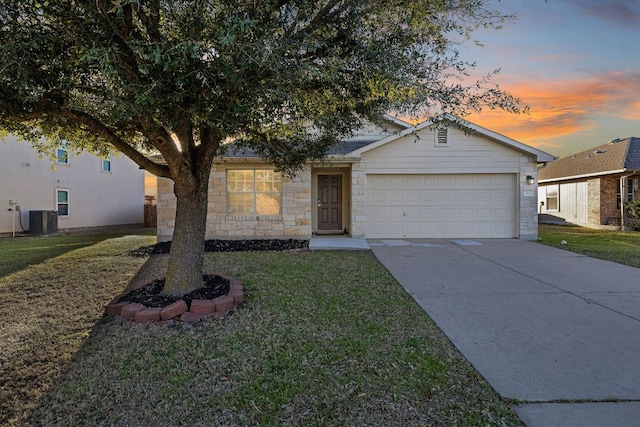 single story home featuring a yard, concrete driveway, an attached garage, cooling unit, and stone siding