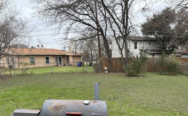 view of yard with a fenced backyard