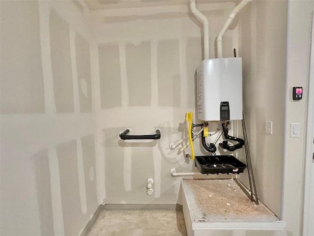 utility room with tankless water heater
