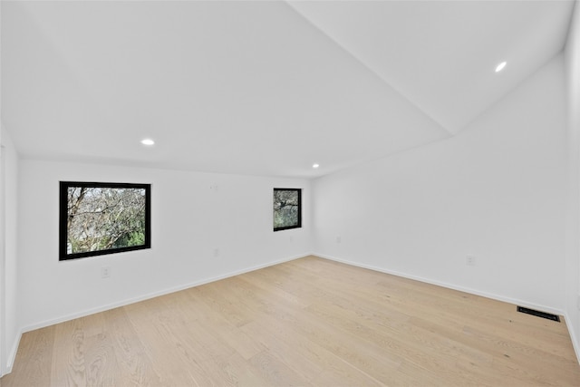 empty room featuring recessed lighting, baseboards, visible vents, and light wood finished floors