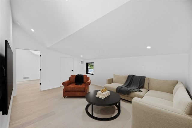 living area with vaulted ceiling, light wood finished floors, visible vents, and recessed lighting