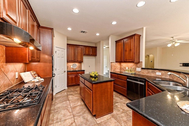 kitchen with visible vents, a sink, dark stone countertops, black gas stovetop, and dishwasher