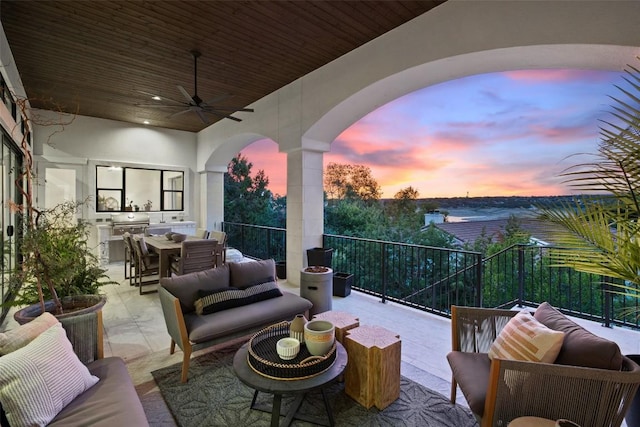 view of patio featuring a ceiling fan, outdoor dining space, outdoor lounge area, and area for grilling