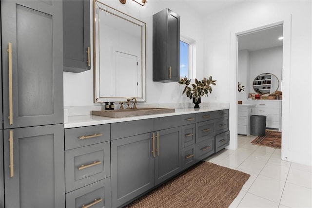 bathroom featuring tile patterned flooring and vanity