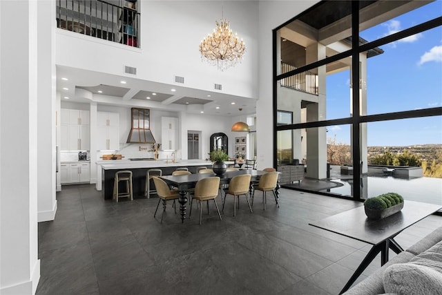 dining space featuring recessed lighting, visible vents, and a notable chandelier