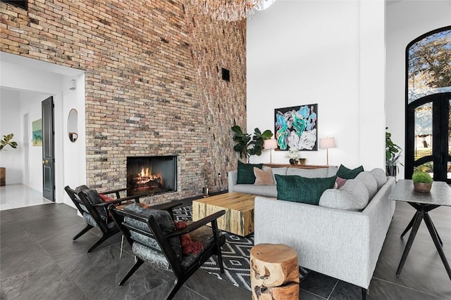 tiled living room with a fireplace and a towering ceiling