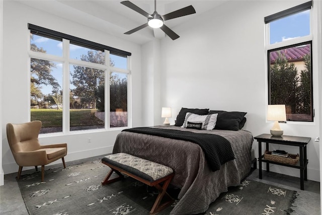 bedroom featuring ceiling fan and baseboards