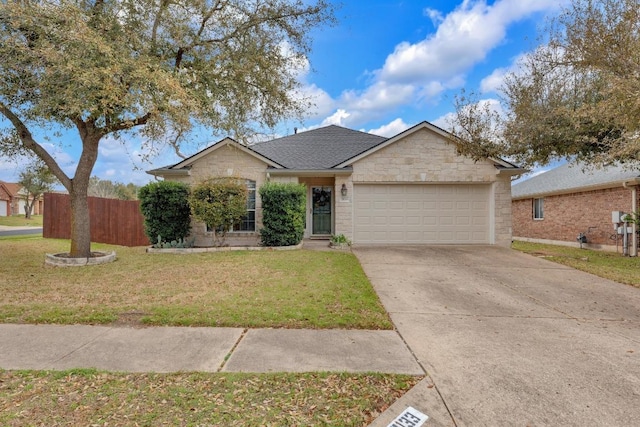 single story home with a front yard, fence, a garage, stone siding, and driveway