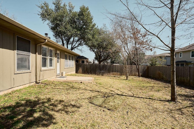 view of yard featuring a patio area and a fenced backyard