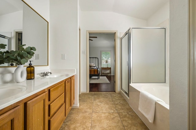 full bath featuring a stall shower, a bath, and a sink