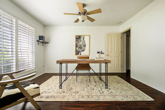 office space featuring ceiling fan, dark wood-type flooring, and plenty of natural light