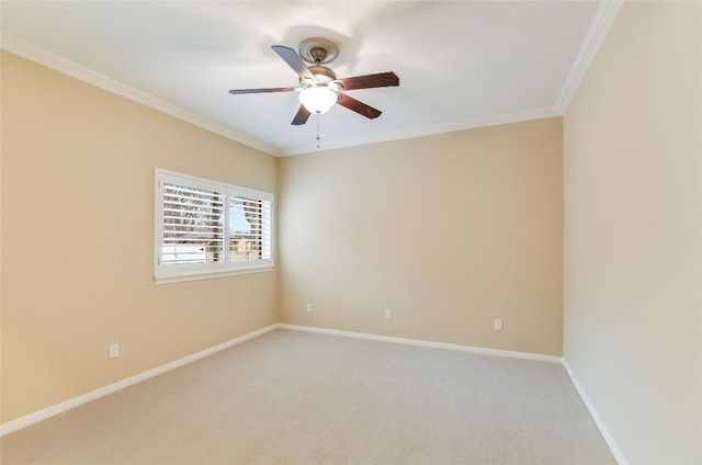 unfurnished room with ceiling fan, baseboards, crown molding, and light colored carpet