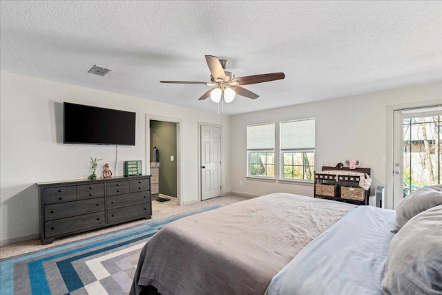 bedroom featuring baseboards, carpet, visible vents, and access to exterior