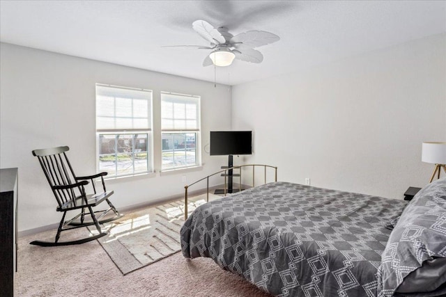 bedroom featuring carpet floors and baseboards