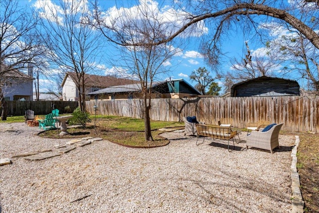 view of yard featuring a fenced backyard, a patio, and an outdoor living space