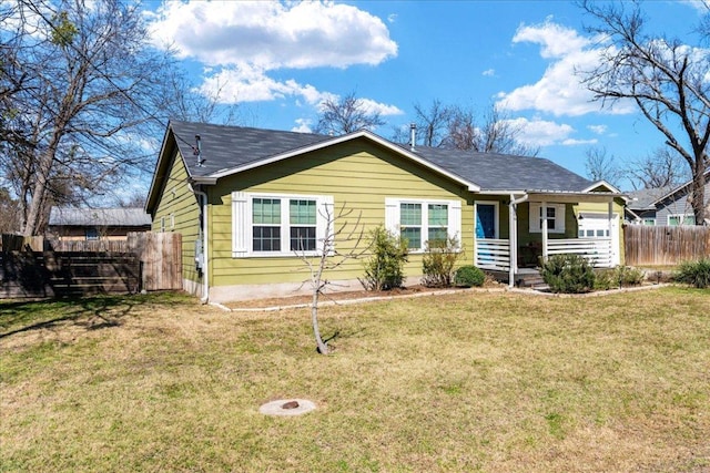 view of front of property with fence and a front yard