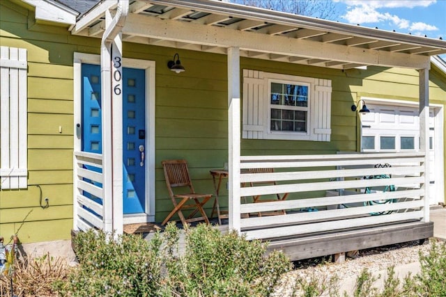 entrance to property with covered porch