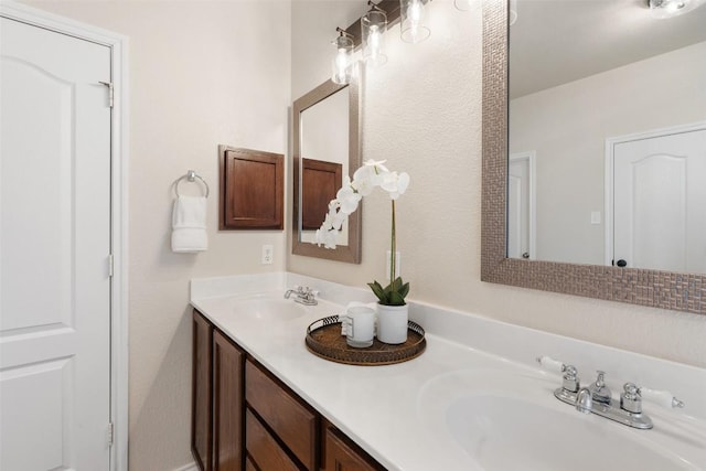 bathroom with double vanity and a sink