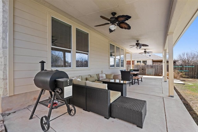 view of patio / terrace featuring ceiling fan, fence, and outdoor lounge area