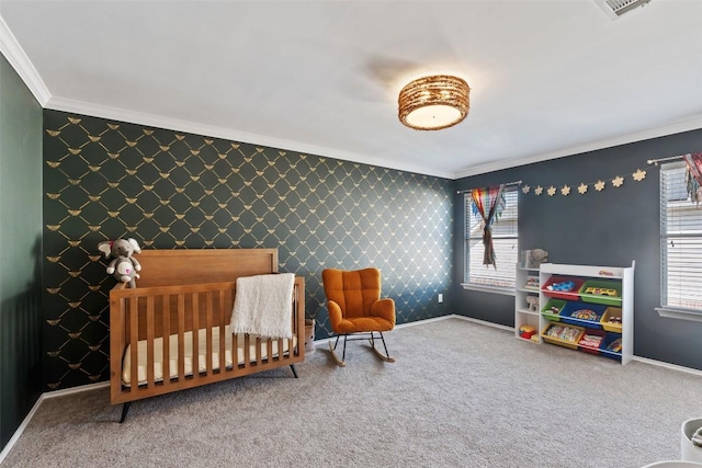 bedroom featuring carpet floors, ornamental molding, an accent wall, baseboards, and wallpapered walls