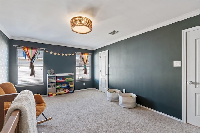 rec room featuring a wealth of natural light, visible vents, and carpet